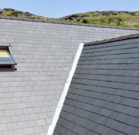 Pitched roof covered in clay tiles at a Brian Gow Roofing Supplies job, showing the battens, tiles and ridge that a specialist supplies as one system.
